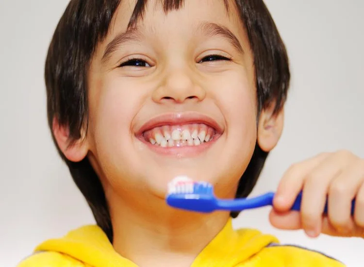A picture of a child brushing his teeth