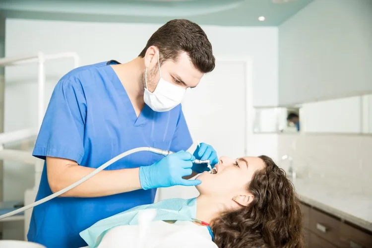 A picture of a dentist in the middle of root canal treatment